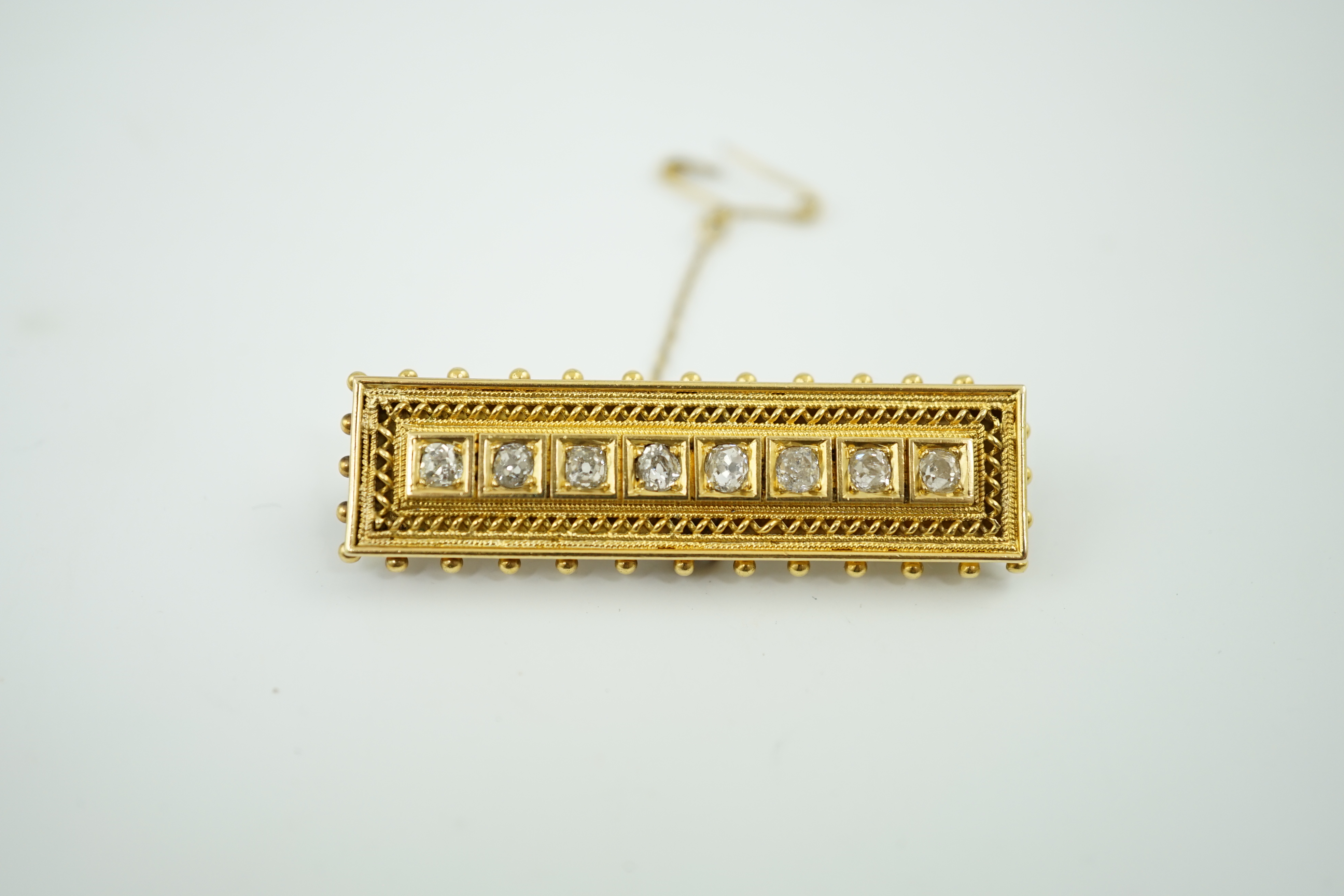 A late Victorian gold and eight stone diamond set brooch